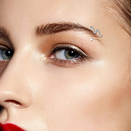 White gold and zircon snake arch piercing