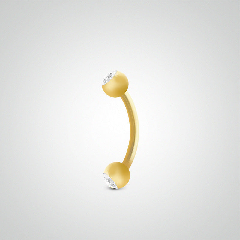 Piercing barre courbe en or jaune avec boules et zircons blancs (1,6mm)