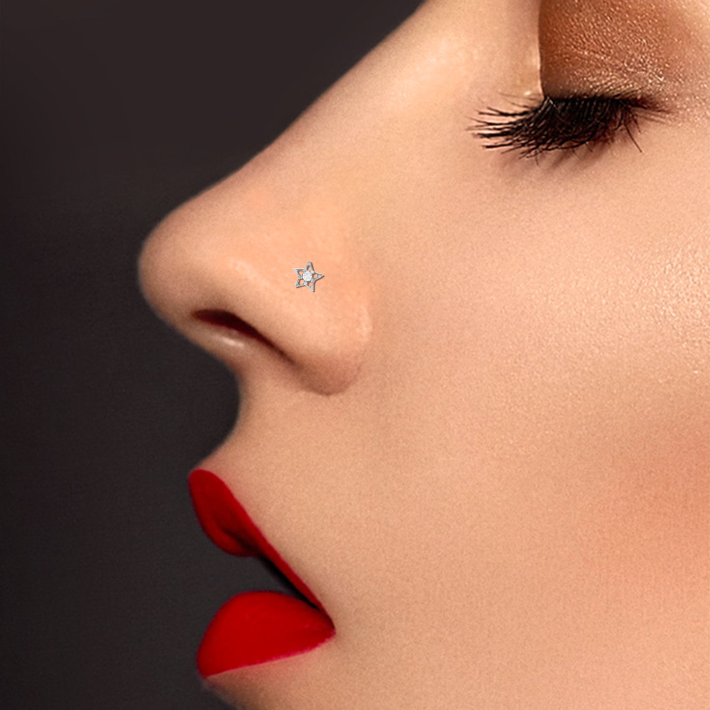 White gold star nose piercing