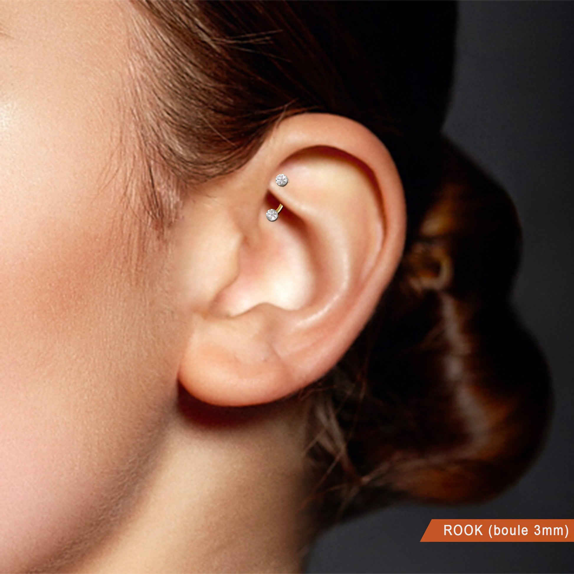Bijou de rook en or avec boules et cristaux